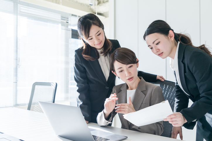 Three businesswomen working in the office. Positive workplace concept. Three businesswomen working in the office. Positive workplace concept.